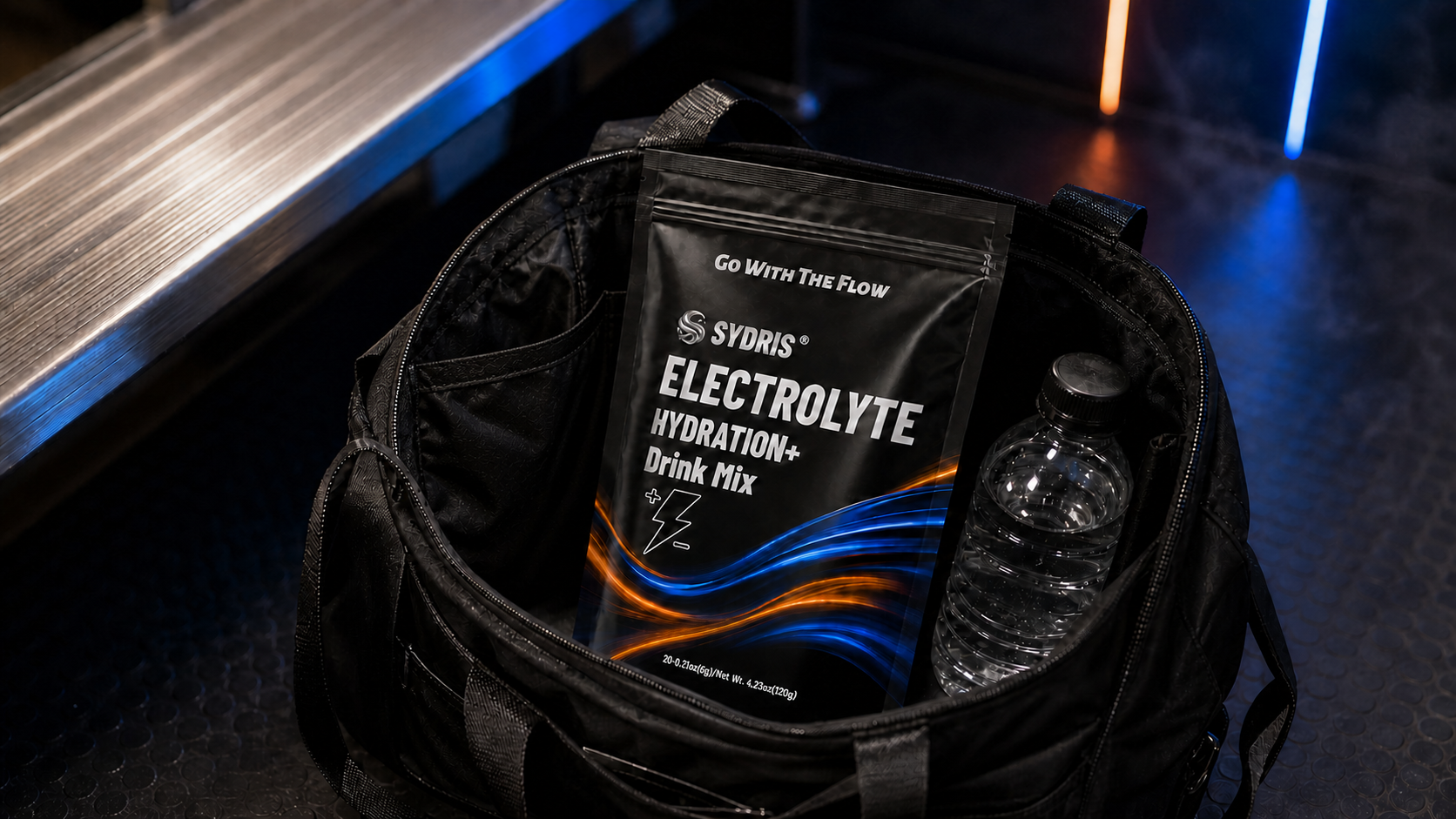 SYDRIS pouch and water bottle packed in a black travel tote.